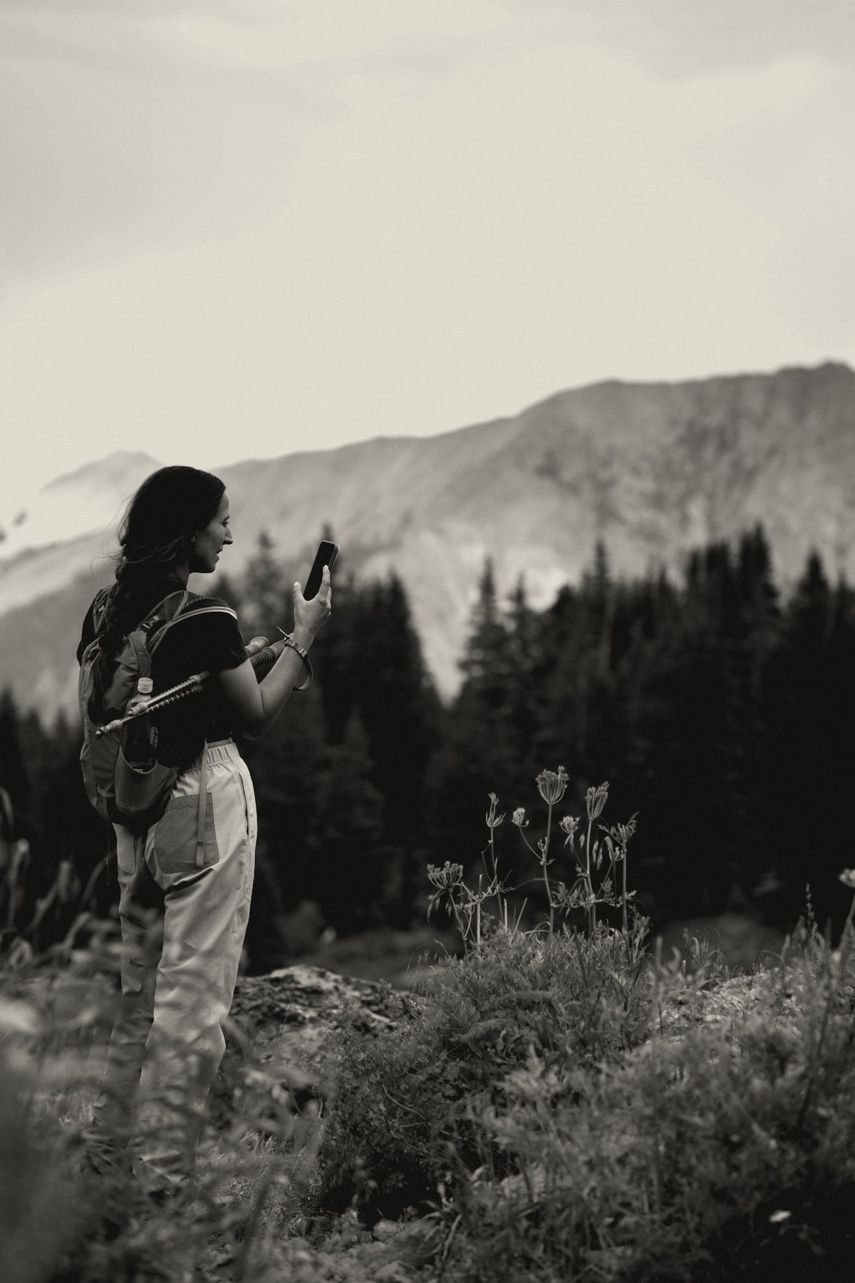 Woman hiker with a pack in alpine country